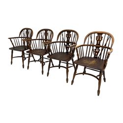 Late 20th century set four oak Windsor elbow chairs, double hoop and stick back with pierced and fretwork work splat, dished seat on turned supports joined by crinoline stretcher 