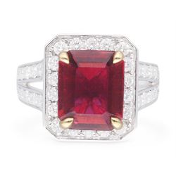 18ct white gold emerald cut rubellite tourmaline and round brilliant cut diamond cluster ring, with diamond set shoulders, hallmarked, rubellite 4.05 carat, total diamond weight 1.24 carat 