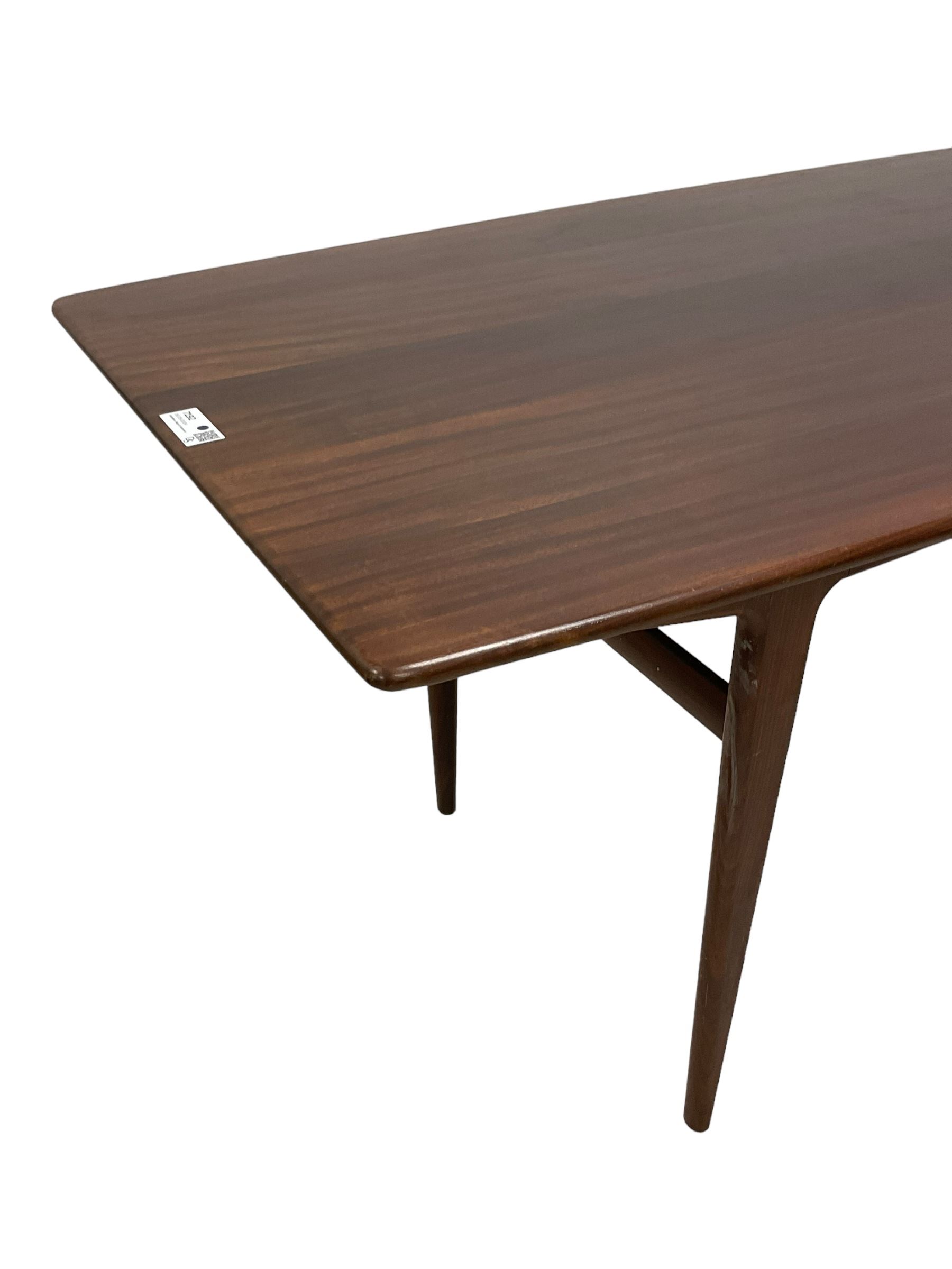 John Herbert for A Younger - mid-20th century teak dining table, curved rectangular top on tapering supports 