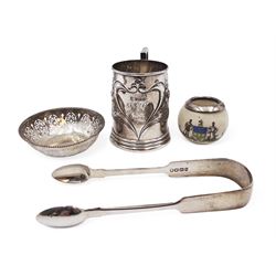 Group of silver, comprising Edwardian christening mug, of slightly tapering form, embossed with floral decoration and engraved initials and date, hallmarked Cooper Brothers & Sons Ltd, Sheffield 1906, a crested ware jar with silver collar, pierced pin dish and a pair of sugar tongs, all hallmarked 