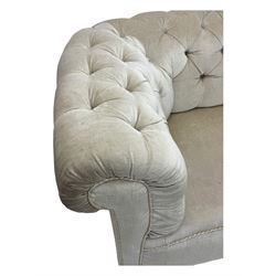 Chesterfield shaped button-tufted sofa, upholstered in pale beige velvet fabric with rolled arms, decorative rope trim and ruched detailing