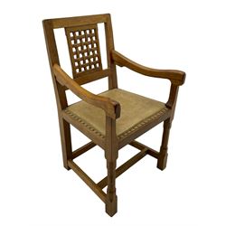 Rabbitman - set of six (5+1) oak dining chairs, pierced and carved lattice back, leather upholstered seat with stud band, on octagonal supports united by stretchers, carved with rabbit signature, by Peter Heap of Wetwang 