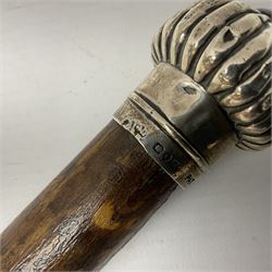 Victorian walking stick, the fluted silver pommel set with banded agate, hallmarked London 1892, maker's mark indistinct, L84cm