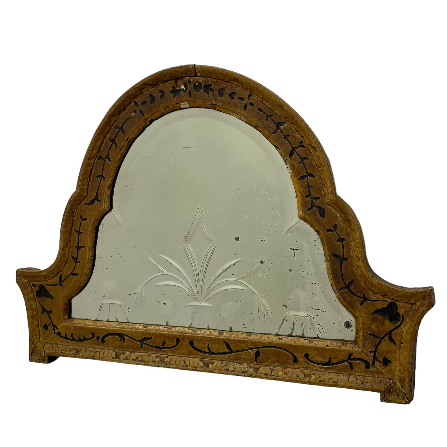 19th century painted pine and gesso wall mirror, stepped arch frame enclosing mirror plate with bevelled stylised leaf decoration and bevelled edge, the frame carved with scrolling leafy branches and painted with black detail, foliate moulded outer edge