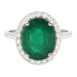 18ct white gold oval cut emerald and round brilliant cut diamond cluster ring, hallmarked,...