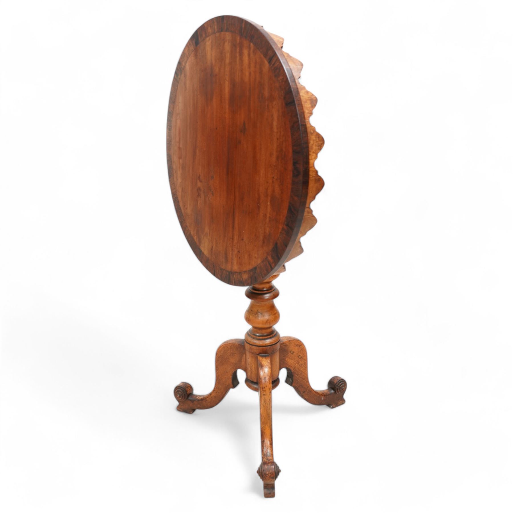 19th century rosewood and mahogany tripod table, circular tilt-top with rosewood band and shaped fretwork skirt, on turned column with three splayed supports with block feet 