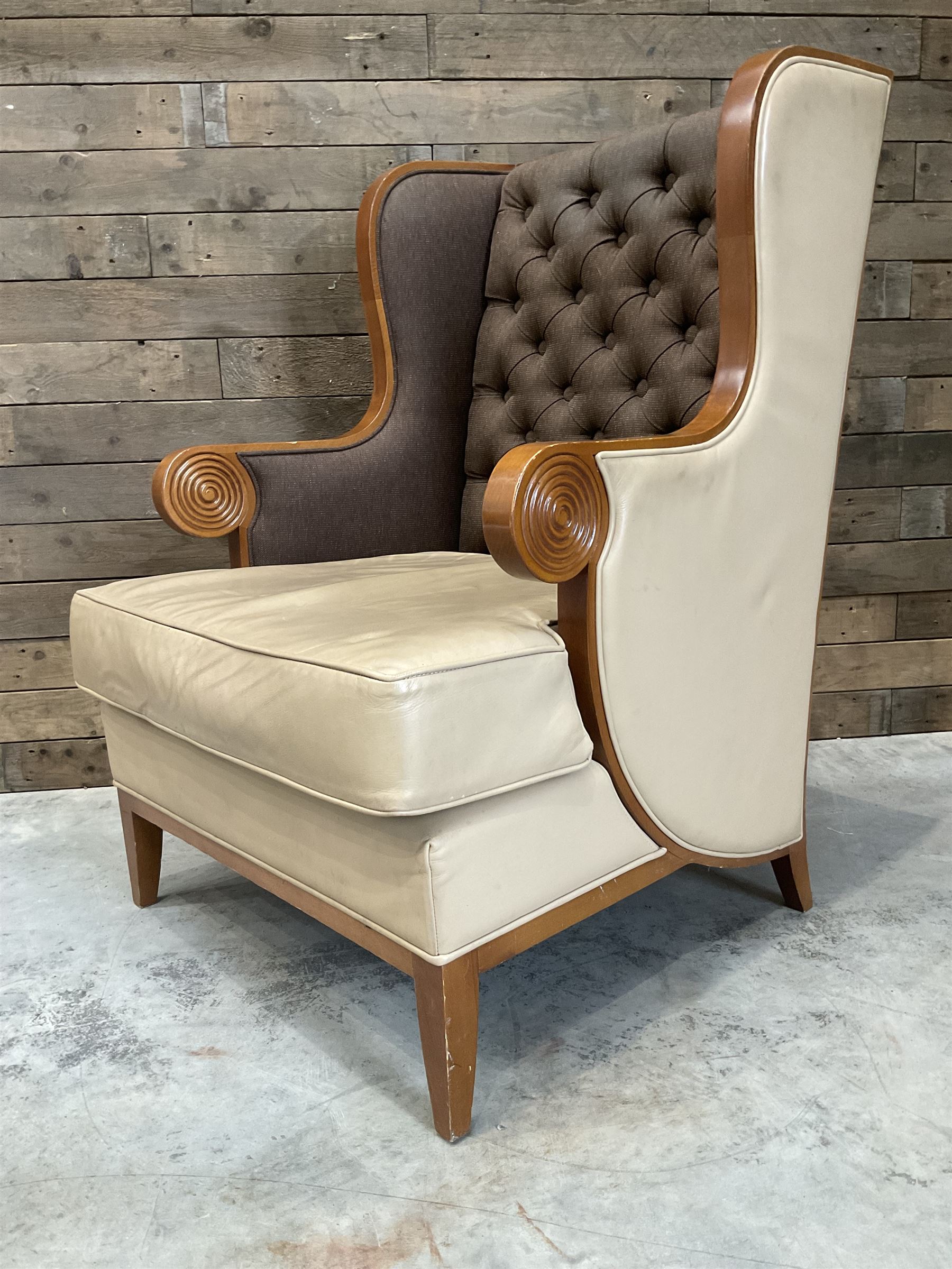 Walnut finish framed wing back armchair upholstered leather and buttoned fabric