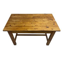 Traditional waxed pine kitchen or dining table, rectangular top over square supports united by H-stretcher