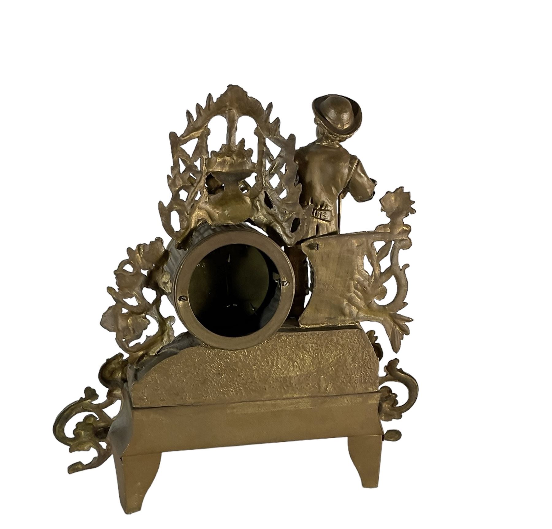 19th century - French gilt spelter 8-day timepiece mantle clock, with an ornate rococo case on splayed feet, drum movement with a cast figure of a gardener, flowers and gardening tools, white enamel dial with Roman numerals, minute markers and matching steel moon hands. With pendulum.   