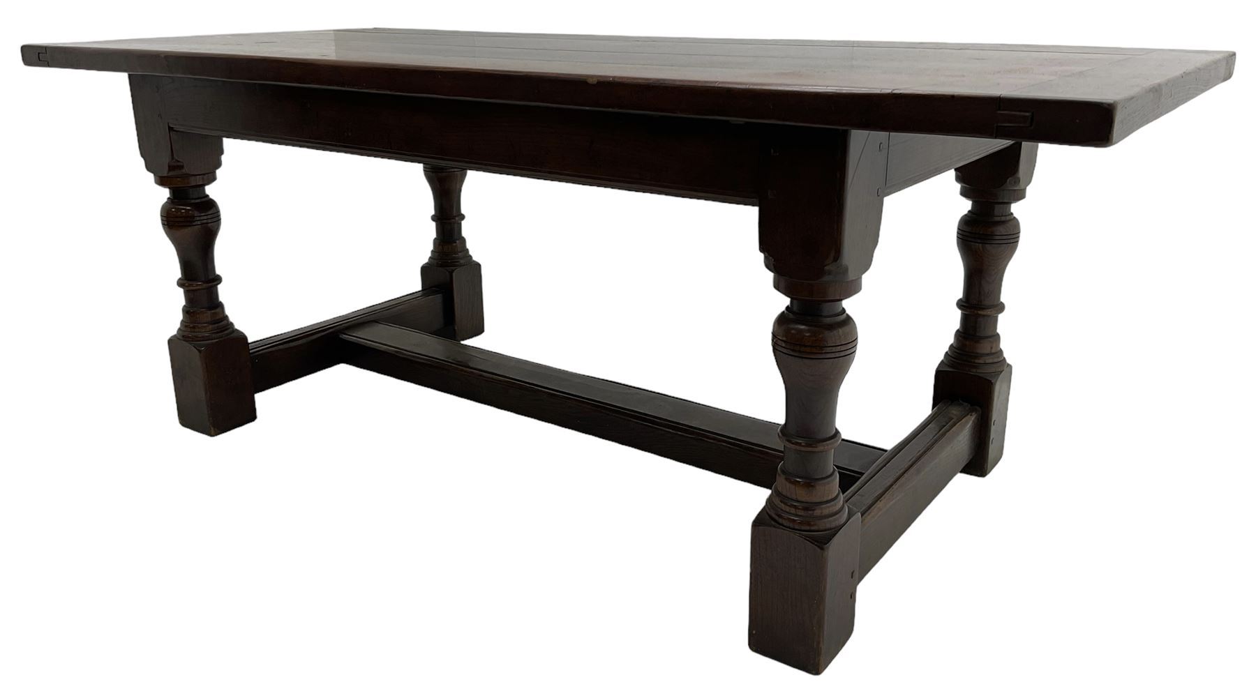 20th century oak refectory dining table, rectangular cleated top on turned supports joined by H-stretcher