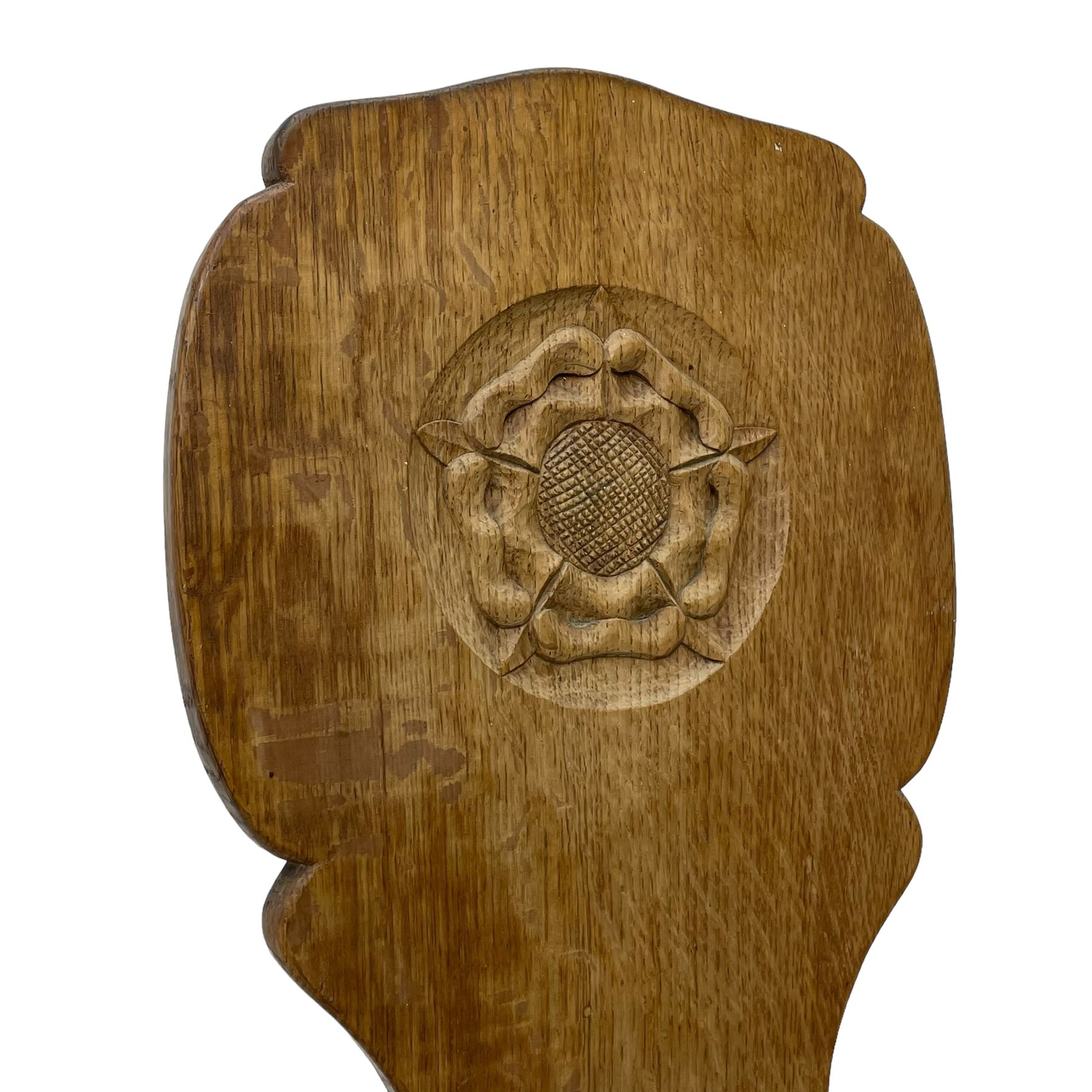 Gnomeman - two oak spinning or hall chairs, shaped splat backs, one carved with Yorkshire Rose, the other with mythical dragon, decagon seats on chamfered square tapering supports, each carved with gnome signature, by Thomas Whittaker, Littlebeck