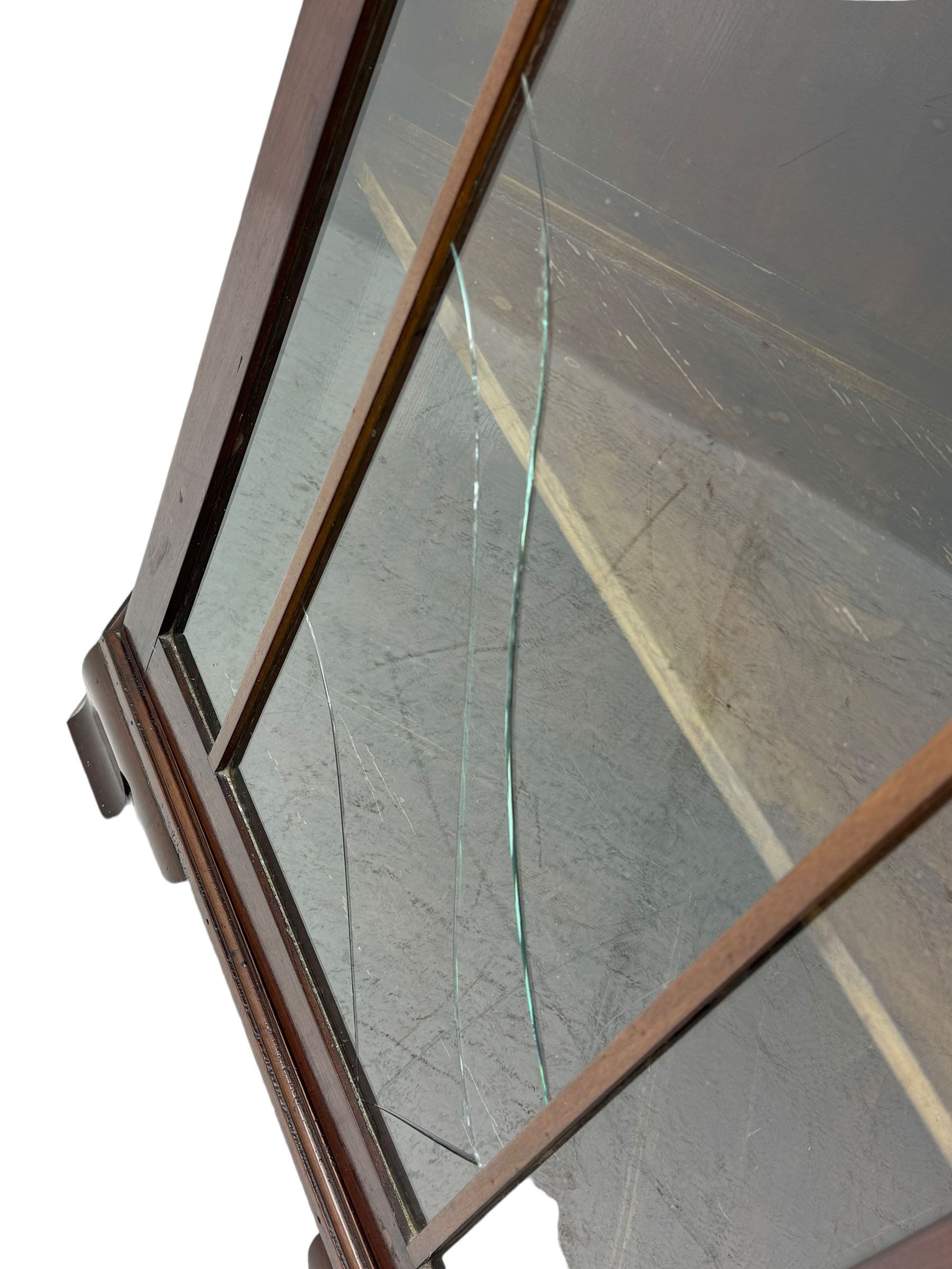 19th century mahogany floor-standing corner display cabinet, moulded cornice over blind fretwork frieze, enclosed by single astragal glazed door, the interior fitted with three shelves, on bracket feet