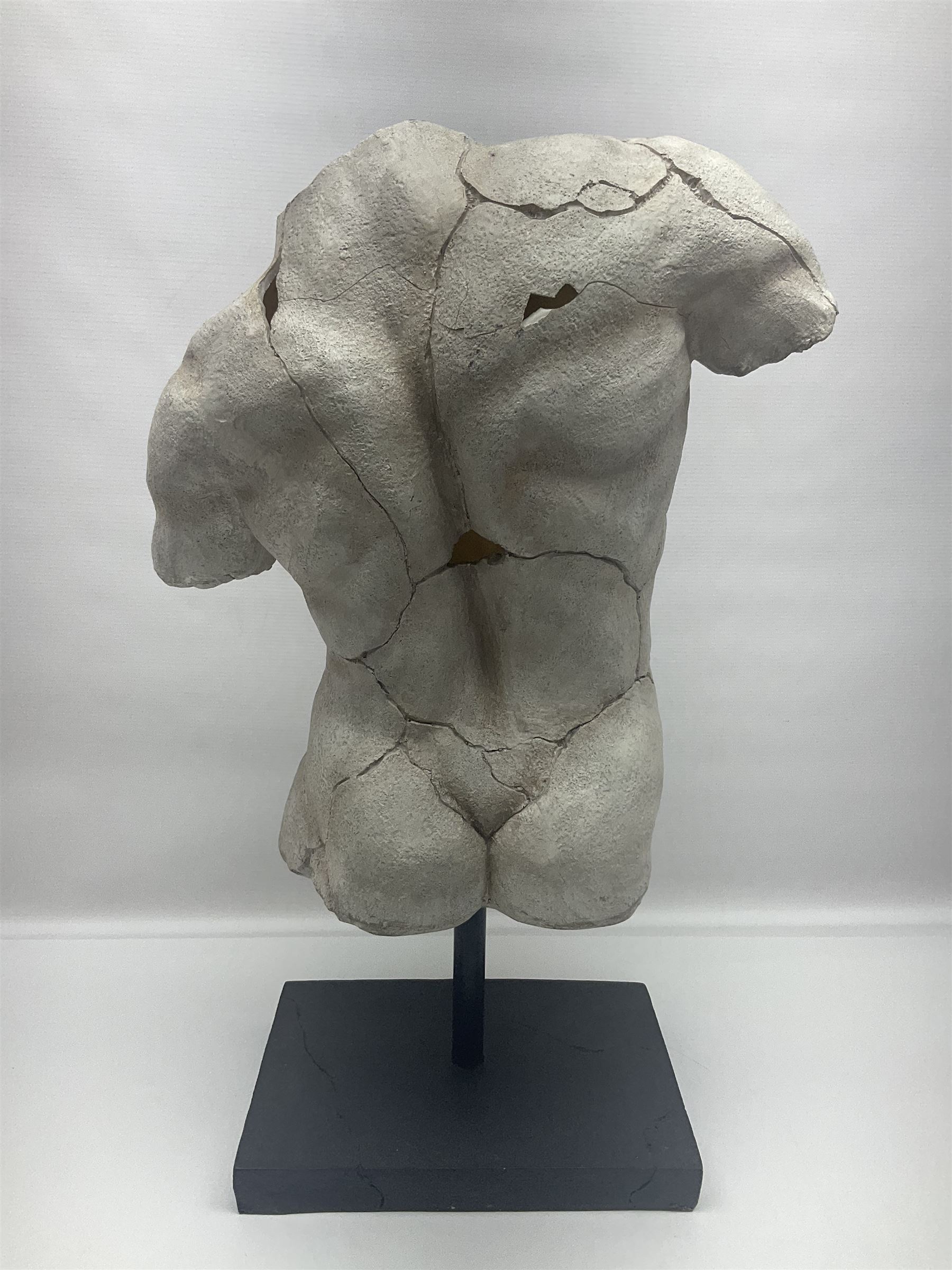 Composite sculpture of a Classical male torso on a stand, H65cm