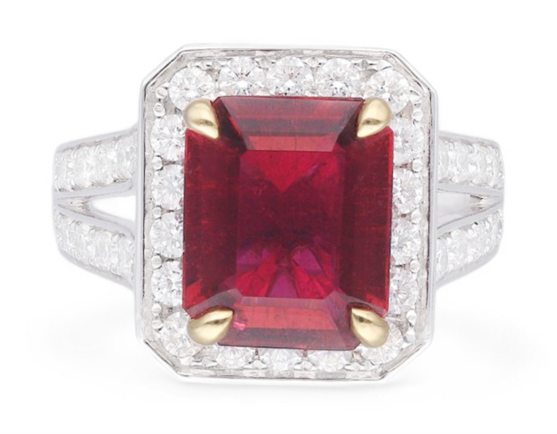 18ct white gold emerald cut rubellite tourmaline and round brilliant cut diamond cluster ring, with diamond set shoulders, hallmarked, rubellite 4.05 carat, total diamond weight 1.24 carat 