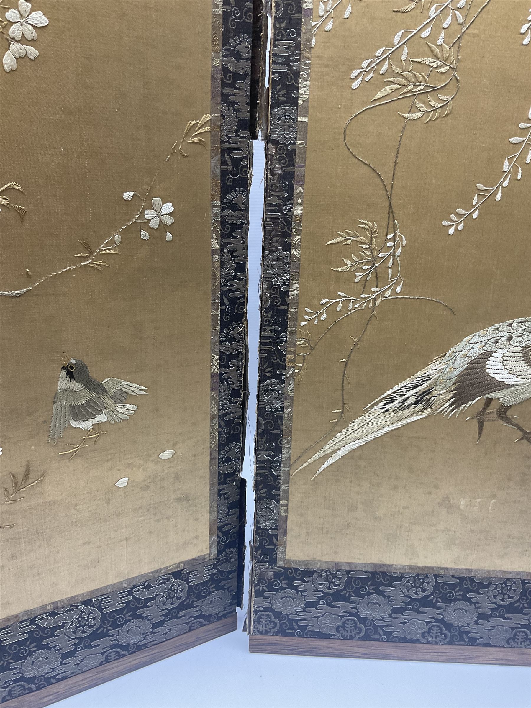 Two Oriental silk and wooden screens embroidered with birds and blossoming branches, largest H88cm 