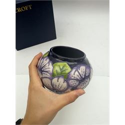 Moorcroft vase in Petunia pattern upon a ble ground, of squat baluster form, marked made for collectables to the base,  with original box, H12cm