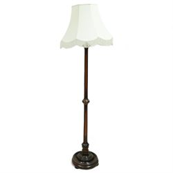 Early 20th century turned walnut standard lamp, with pleated shade