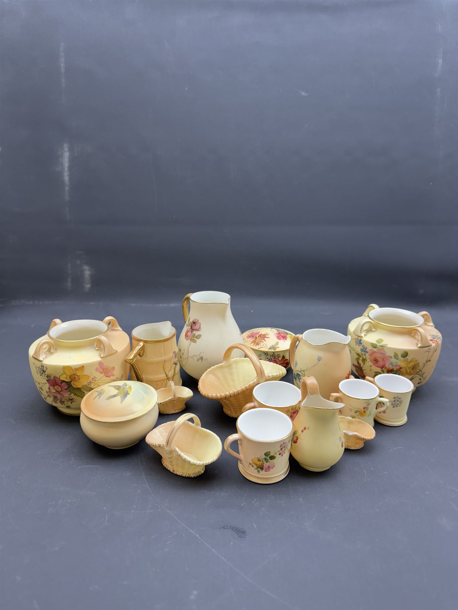 Collection of Royal Worcester blush ivory ceramics, including a graduating set of posey baskets, miniature flatback jug, covered jars etc (19) 