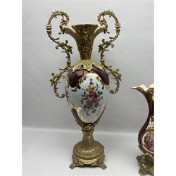 Twin handled vase, the ceramic urn form body decorated with floral sprigs and figural panel, the metal handles designed as vines, together with a similar ewer, vase H75cm 