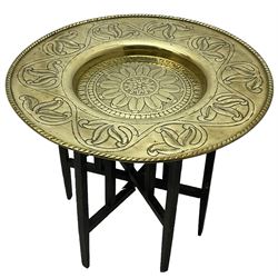 Early 20th century Benares table, circular brass top with pressed trailing leaf pattern, on folding base (D66cm, H59cm); brass coal scuttle; circular brass tray; copper kettle (4)