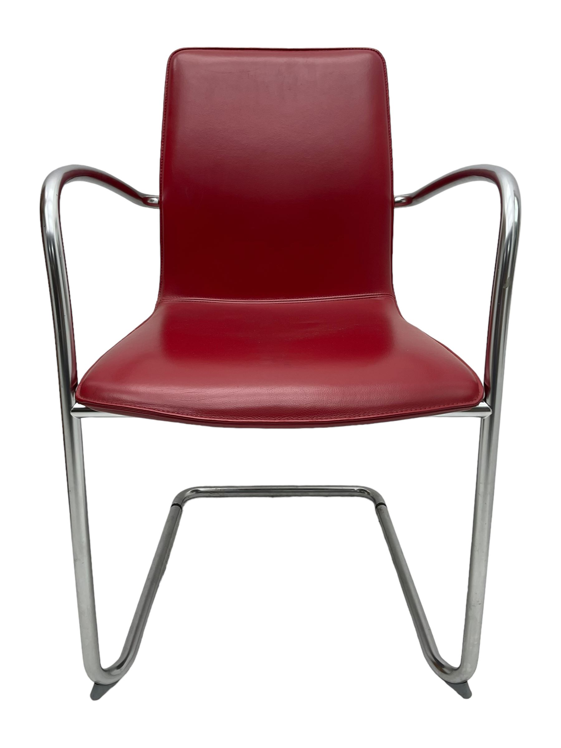 Kusch & Co - contemporary chrome framed armchair upholstered in red leather