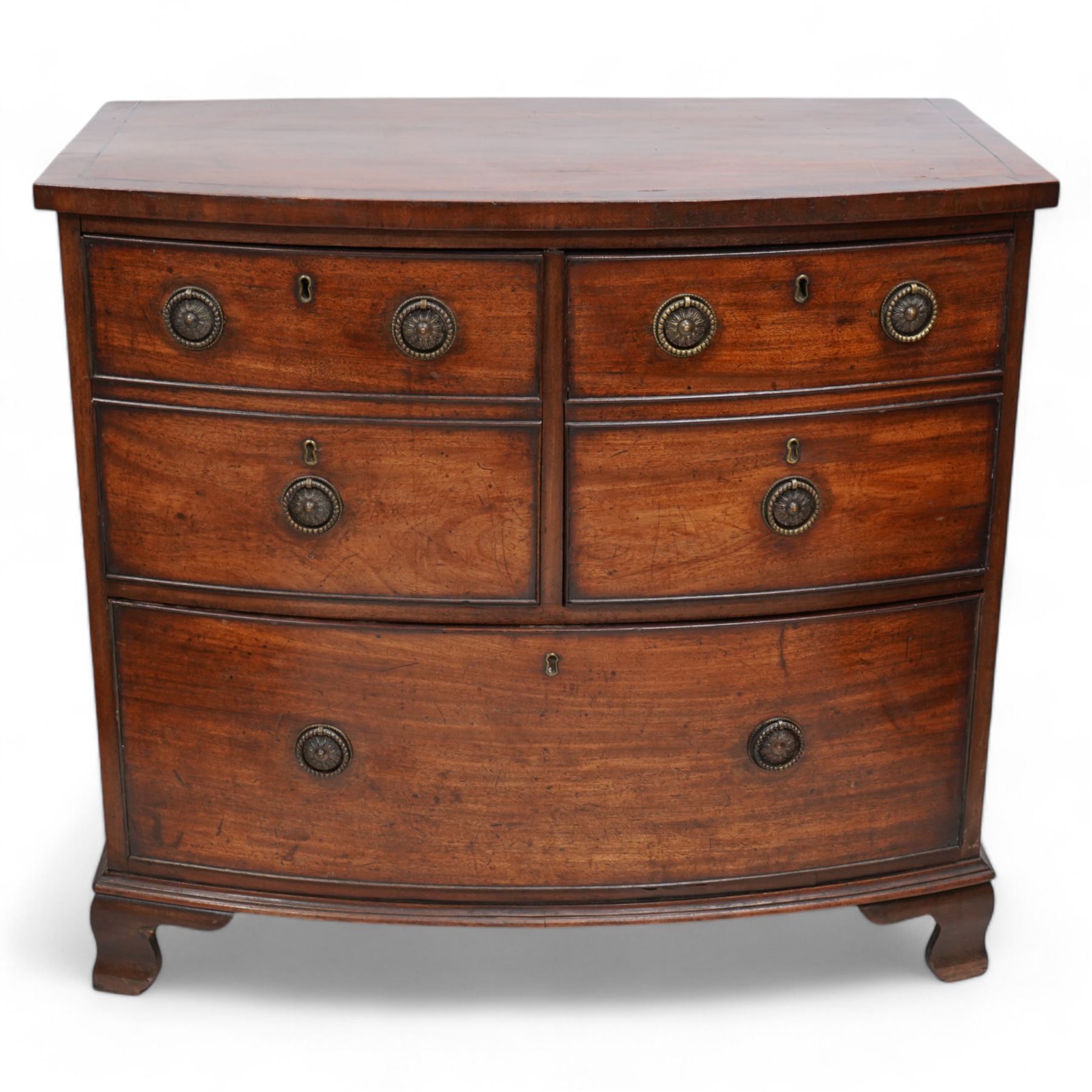 George III mahogany bow-fronted wine chest, banded top over two short and single long drawer, the two short drawers with baize lining and divisions, on ogee bracket feet 