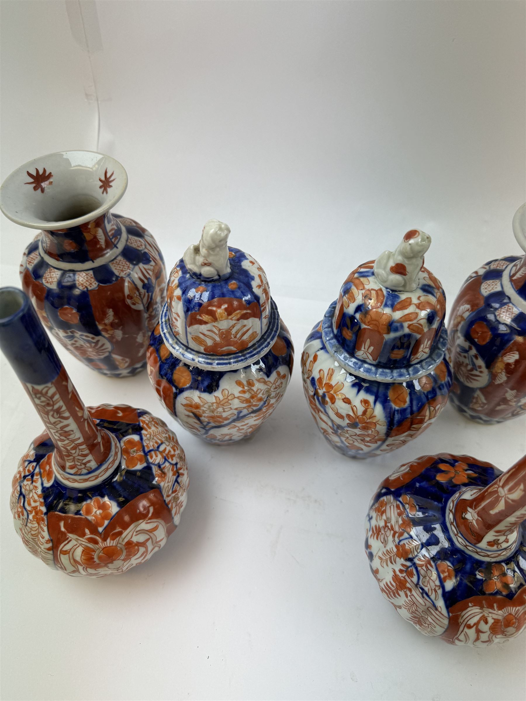 Three pairs of Imari vases, including a pair of baluster form with covers with foo dog finials, tallest H21cm 