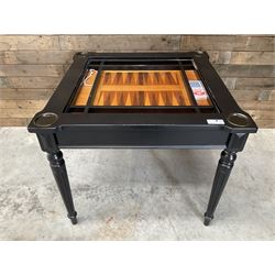 Ebonised square games table, reversible chessboard top revealing games compartment