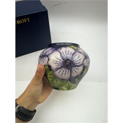 Moorcroft vase in Petunia pattern upon a ble ground, of squat baluster form, marked made for collectables to the base,  with original box, H12cm