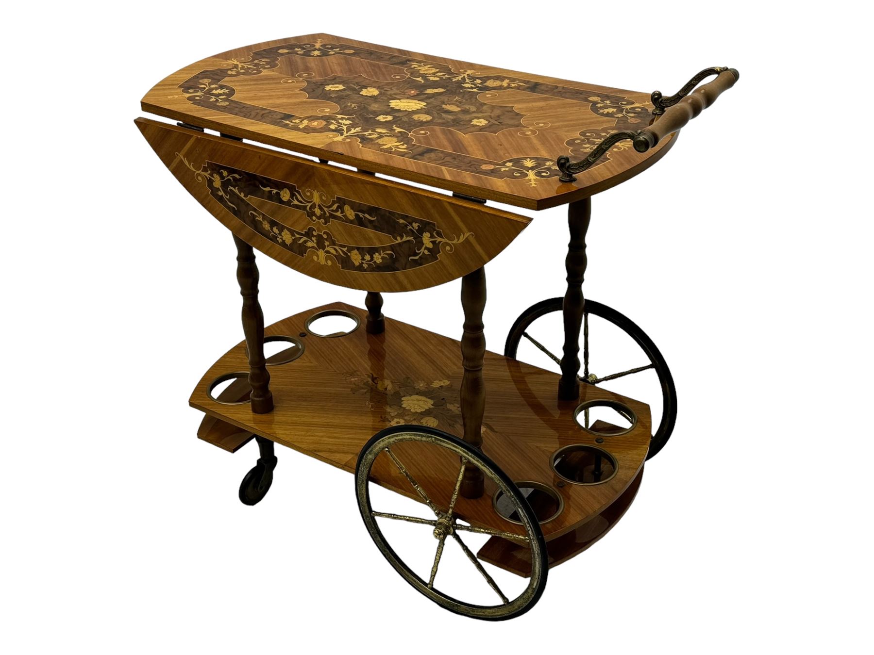 Mid 20th century walnut and satinwood drinks trolley, drop-leaf top with Italian marquetry, turned supports connecting lower shelf fitted with bottle holders and additional storage, on large brass-spoked wheels