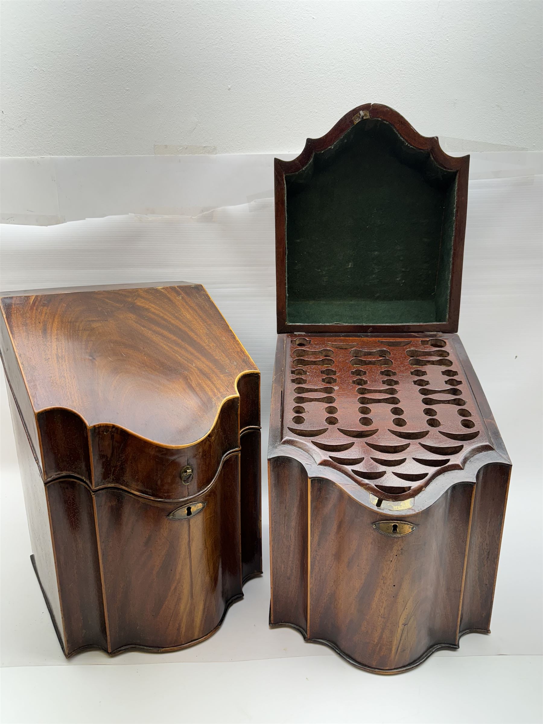 Pair of George III mahogany knife boxes, each of serpentine fronted form with strung detail to the hinged cover and body, opening to reveal a fitted interior, H38cm