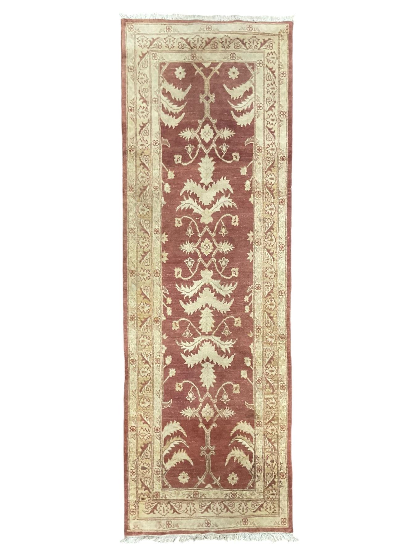 Persian Zeigler crimson ground runner rug, the field decorated with stylised foliate motifs and leafage, densely decorated guard band with floral and geometric patterns