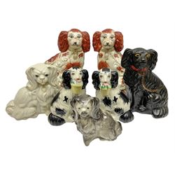 Two Pairs of Staffordshire style dogs, together with three other examples, largest example H27cm