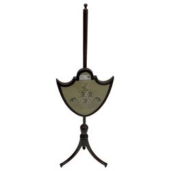 19th century mahogany pole screen, embroidered panel with heraldic crest in shield frame, on splayed tripod base