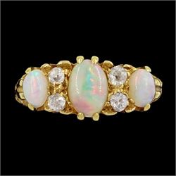 Early 20th century 18ct gold three stone opal and four stone old cut diamond ring, hallmarked