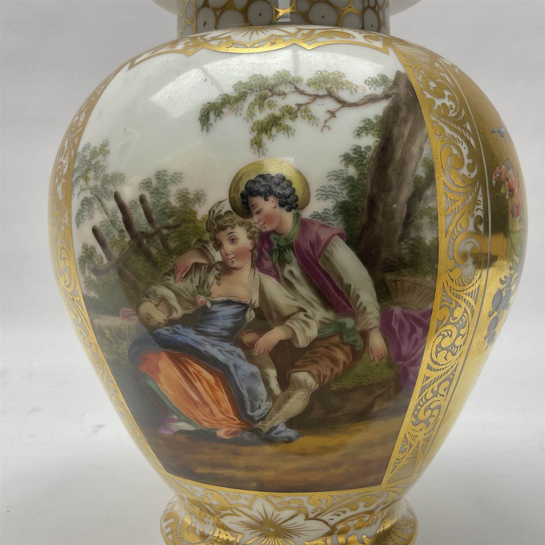 Pair of late 19th century Helena Wolfsohn vases and covers, each of baluster form with domed cover, painted with alternating panels of romantic scenes and floral sprays upon gilt ground, with Augustus Rex mark to base, H27cm