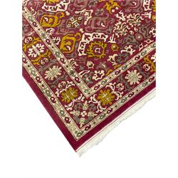 Persian design red ground rug, decorated with stylised plant motifs, repeating border within Boteh decorated guard stripes 