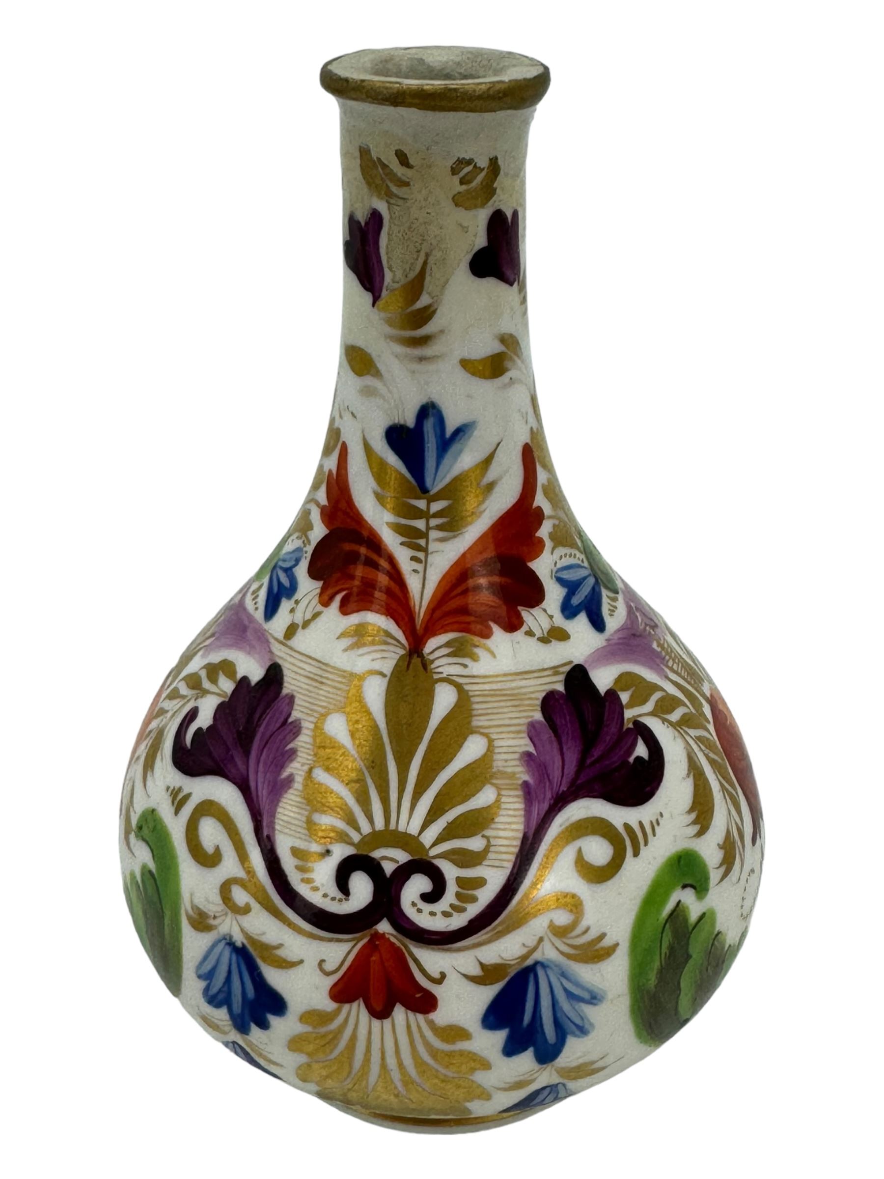 Early 19th century Derby porcelain to include a campana form inkwell, small bottle form vase, twin handled vase and flared rim vase, hand painted with a landscape scene, H10cm (4)