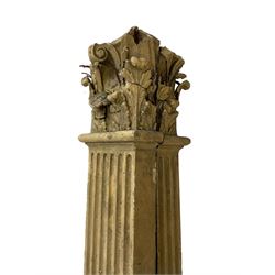 Three 19th century wood and gesso Composite order architectural architraves - curled acanthus leaf capitals over fluted shafts, the bases decorated with guilloche moulding over trailing laurel leaf branches, one half columns, one L-shaped rectangular pilaster and one full column, the largest - H204cm