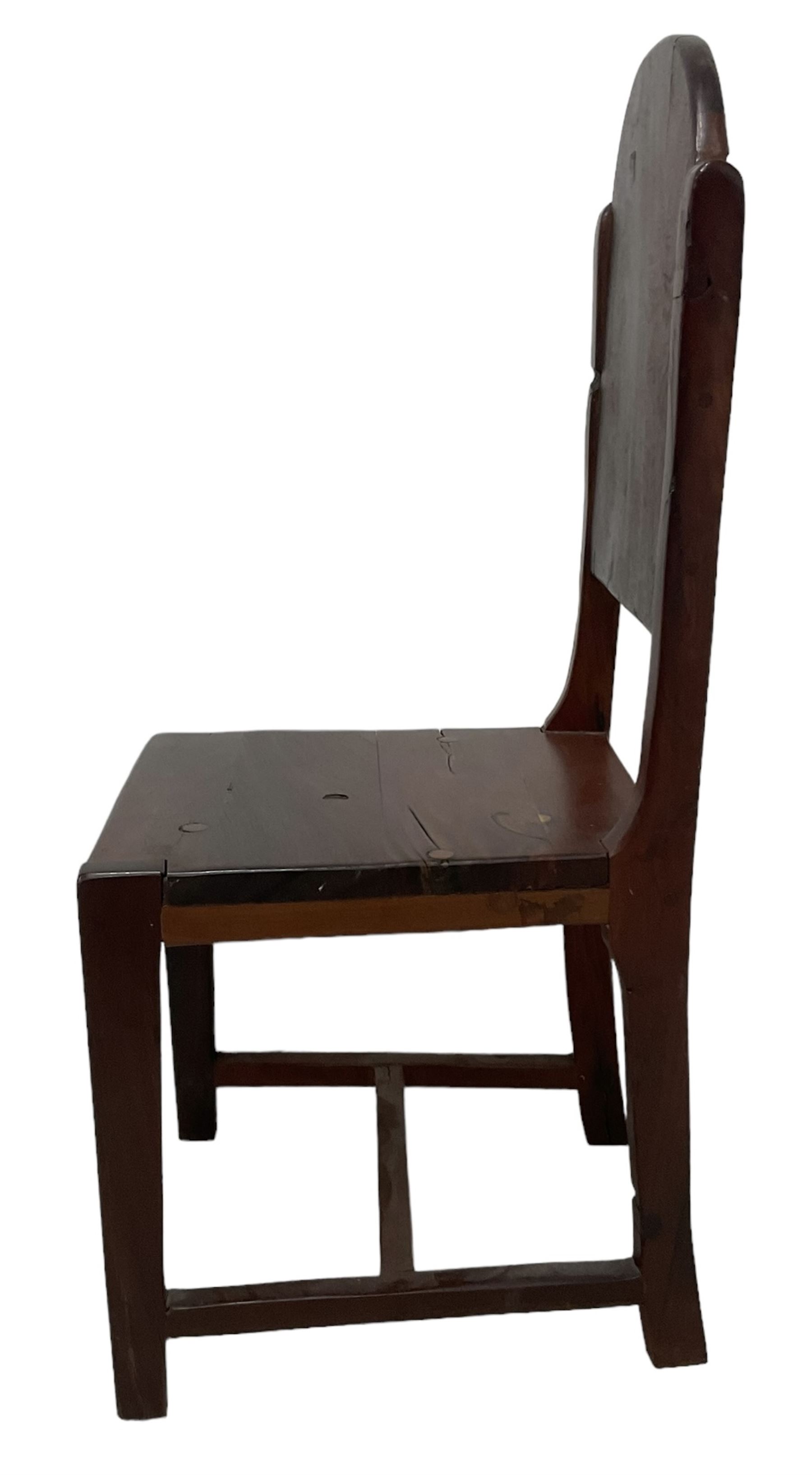 Mid-to-late 20th century teak dining table, rectangular top with canted corners, on square tapering supports with spade feet (214cm x 119cm, H76cm); and a set of eight Burmese reclaimed teak dining chairs, high arched back over panelled seat