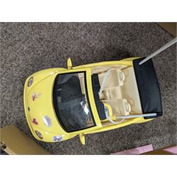 Collection of Barbie dolls, clothes, horse, stable and accessories, including, together with a Mattel Barbie yellow Volkswagen Beetle, with mobile phone remote control