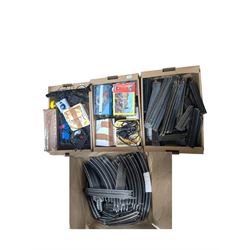 Collection of model railway accessories, including OO gauge track, control units etc, in four boxes 