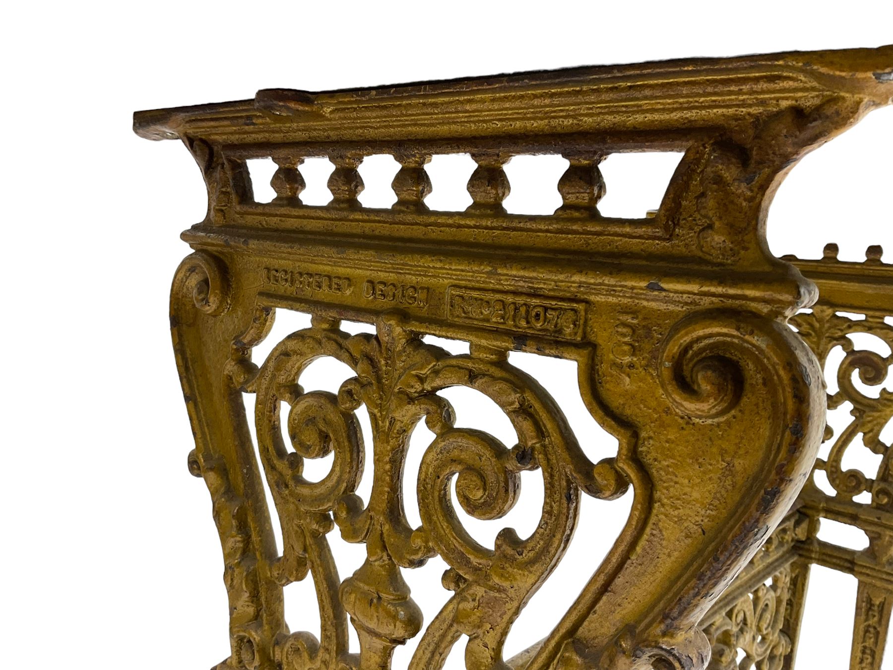 Pair of 19th century cast iron entrance tables, rectangular marble top over ornate gilt bases with scrolling foliate design and sledge feet, united by balustrade stretcher with scroll spandrels