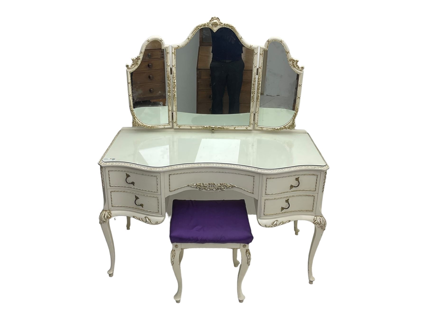 Mid 20th century French style dressing table, triple mirror back and serpentine front with gilt moulded edges, over five drawers with floral and foliate motifs, on cabriole supports; matching stool (2)