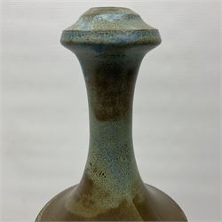 John Egerton (c1945-): studio pottery stoneware lamp base, decorated with cranes in a riverscape upon a mottled brown ground, H51cm