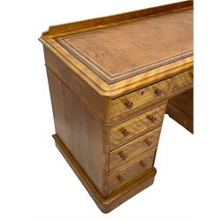 Victorian satin walnut twin pedestal desk, moulded rectangular top with rounded corners and raised back, inset leather writing surface with tooled borders, fitted with nine drawers with turned handles, on moulded plinth base 