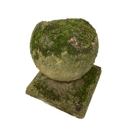 Set of three weathered cast stone gate post finials, circular orb on step-canted square base 