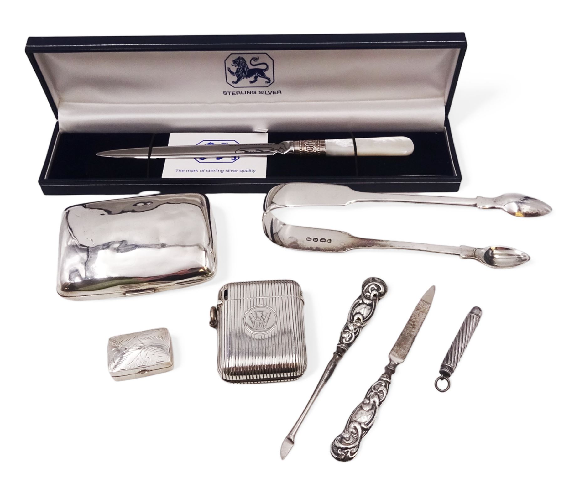 Group of silver, including vesta case, cigarette case, sugar tongs, pill box, letter opener etc, all hallmarked 