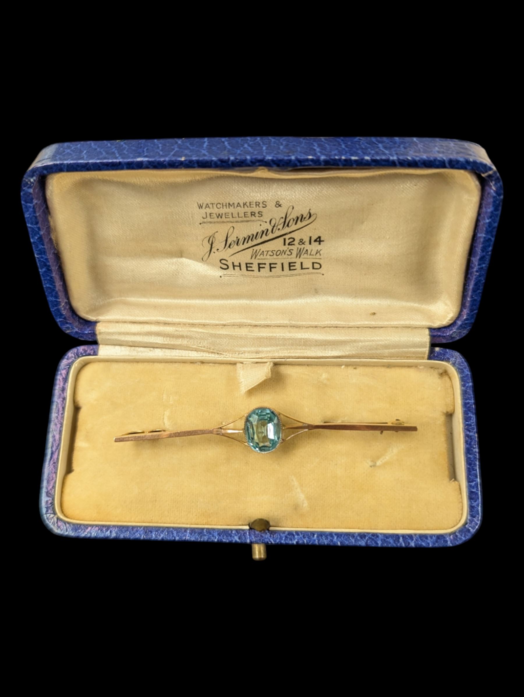 9ct gold blue stone set bar brooch, stamped 9ct, boxed