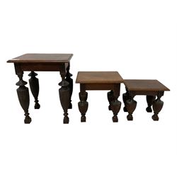 Late Victorian walnut nest of three tables, rectangular top with moulded edge, raised on reeded and turned urn shaped supports with acanthus leaf carving and square feet